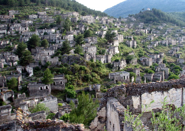 Buildings empty all, Kayakoy stretches out across a hill.