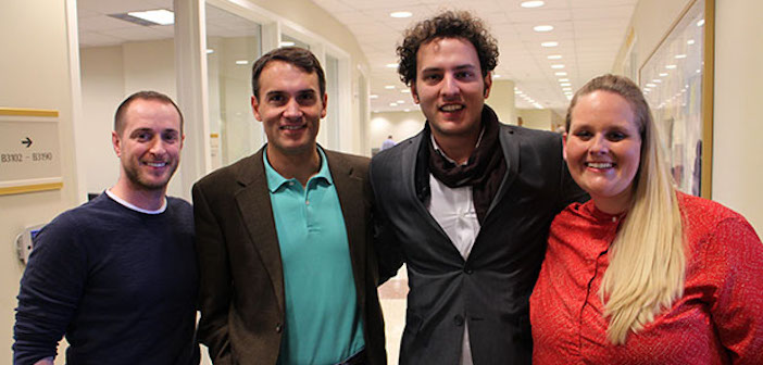Nikos Kavounis, second from right, is bringing his Greek sparkling wine to the U.S. with help from VCU MBA students Jonathan Stoffer, left, Matt Guise and Kristina Friar. Photo by Jonathan Spiers, Richmond Bizsense
